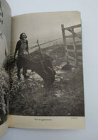 Picture of a woman pushing a wheelbarrow from the first edition of Sackville-West's The Women's Land Army (1944)