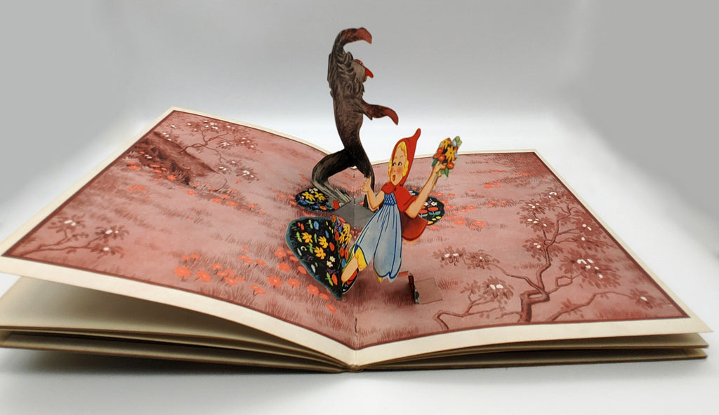 Pop up illustration of the wolf attacking Little Red Riding Hood from Blue Ribbon's Little Red Ridinghood (1934)